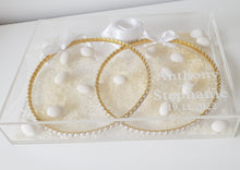 Load image into Gallery viewer, Evelyn (Gold) Stefana tied together with a white satin ribbon paired with a personalised acrylic keepsake Stefanothiki box. Traditional almonds and rice included.