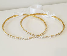 Load image into Gallery viewer, Evelyn (Gold) Stefana tied together with white satin ribbon.  Striking crystals with 3mm white pearls in a thick double row design on a Gold plated band.
