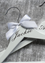 Load image into Gallery viewer, White Wooden Coat Hanger with Silver Name and White Bow
